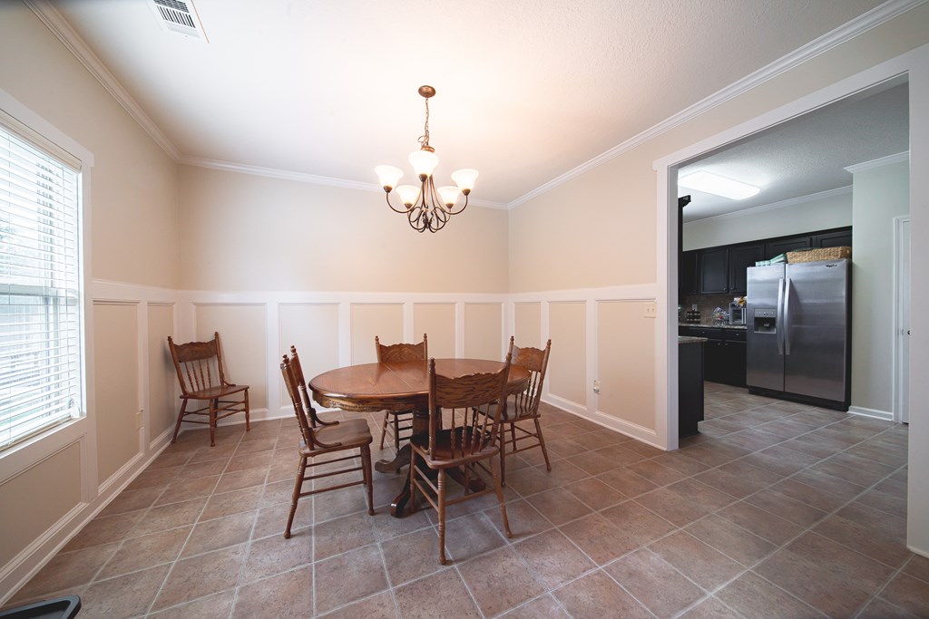 305 Owens Road Fort Mitchell, AL 36856 - Photo 10 of 44 a view of a dining room with furniture and chandelier