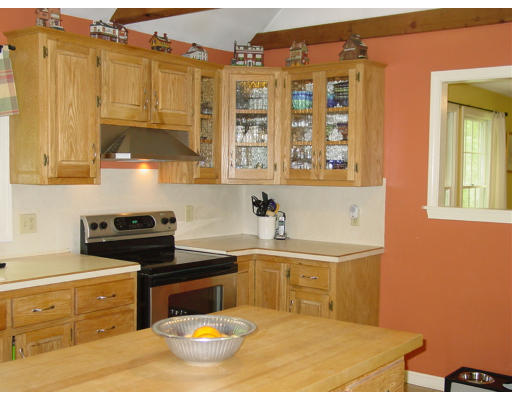 75 North Wales Road Holland, MA 01521 - Photo 3 of 10 a kitchen with stainless steel appliances granite countertop a stove a sink and a microwave