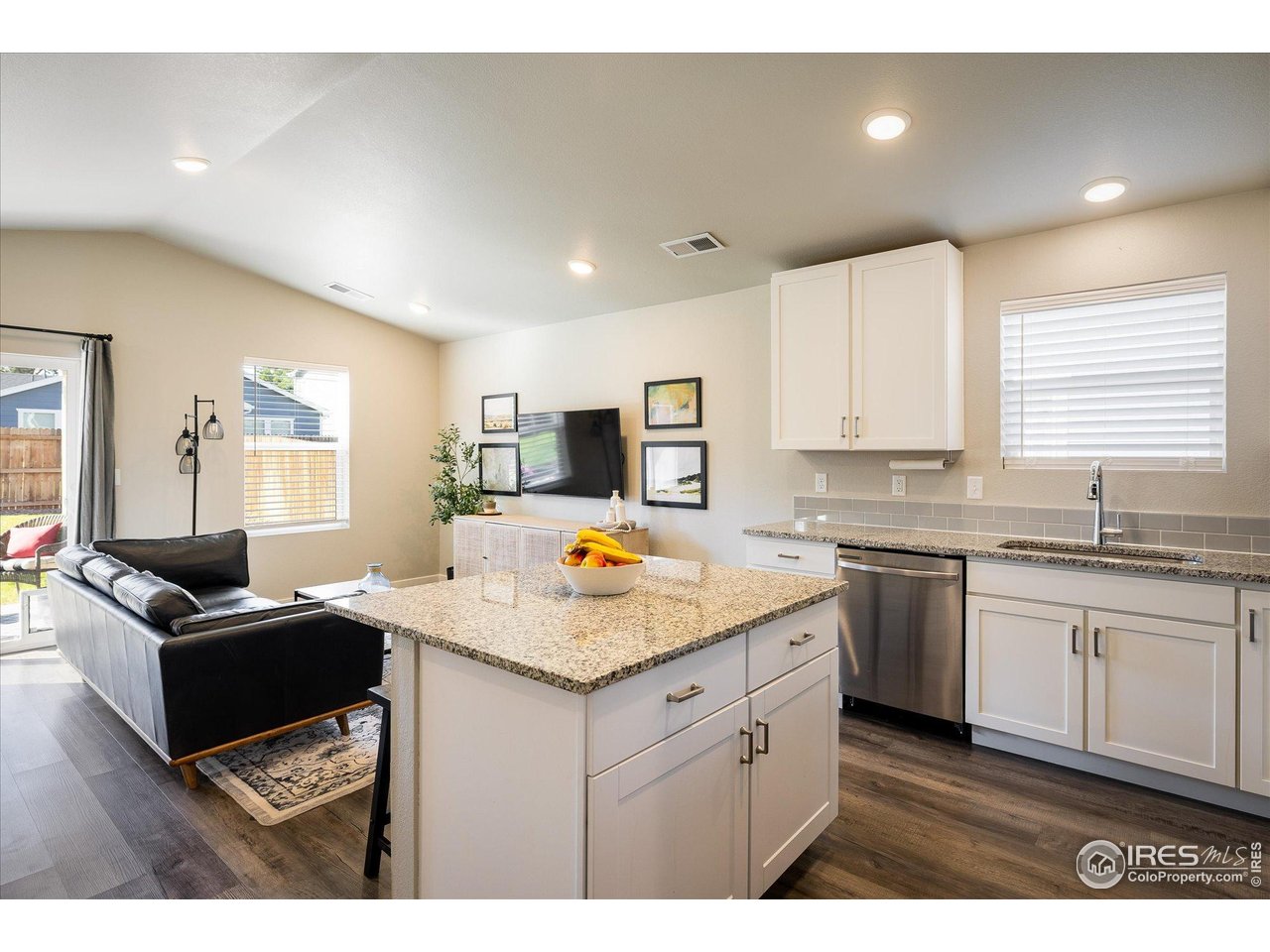 735 South Hoover Avenue Fort Lupton, CO 80621 - Photo 1 of 21 a kitchen with stainless steel appliances granite countertop a sink stove and cabinets