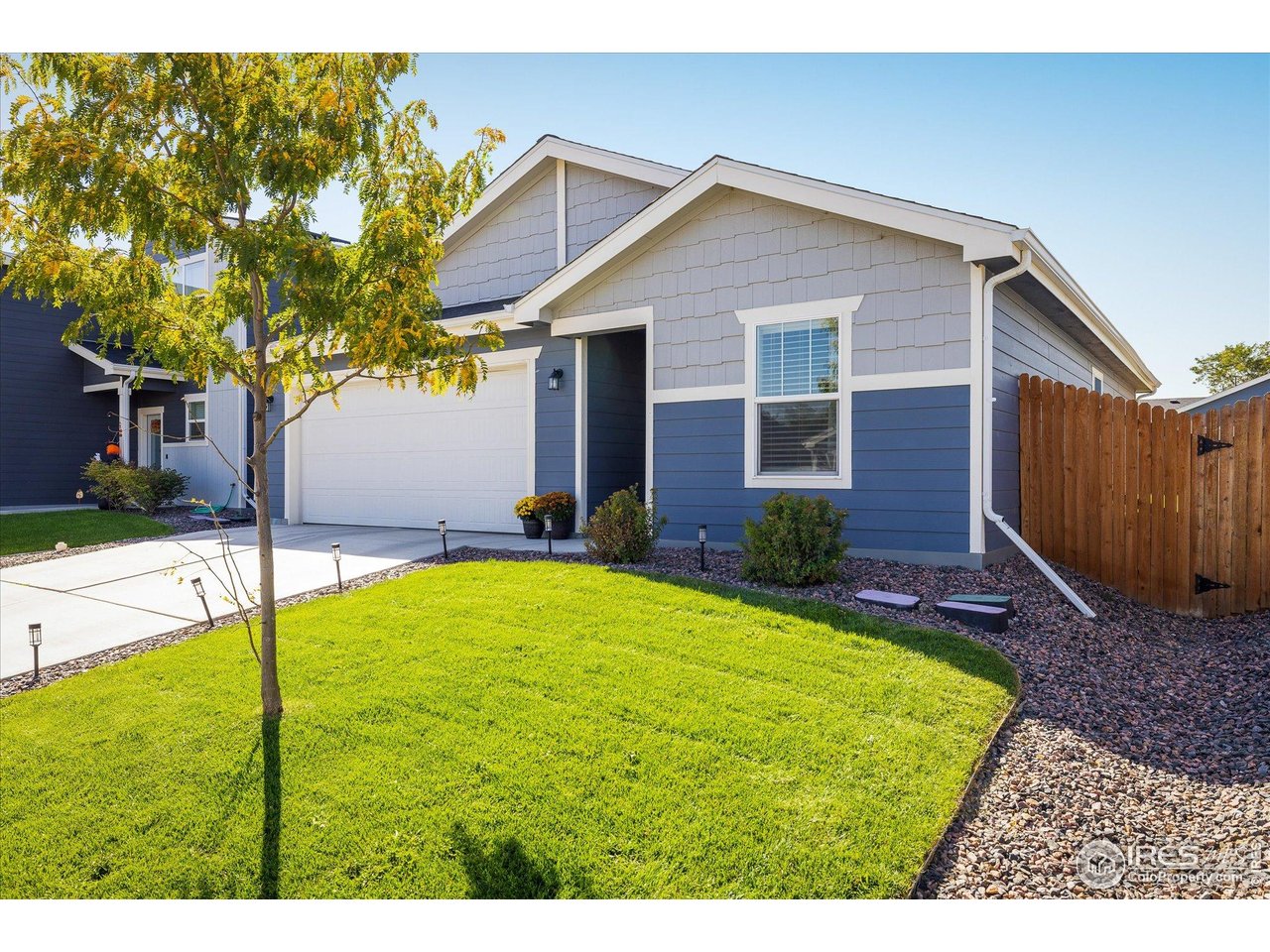 735 South Hoover Avenue Fort Lupton, CO 80621 - Photo 2 of 21 a house view with a garden space