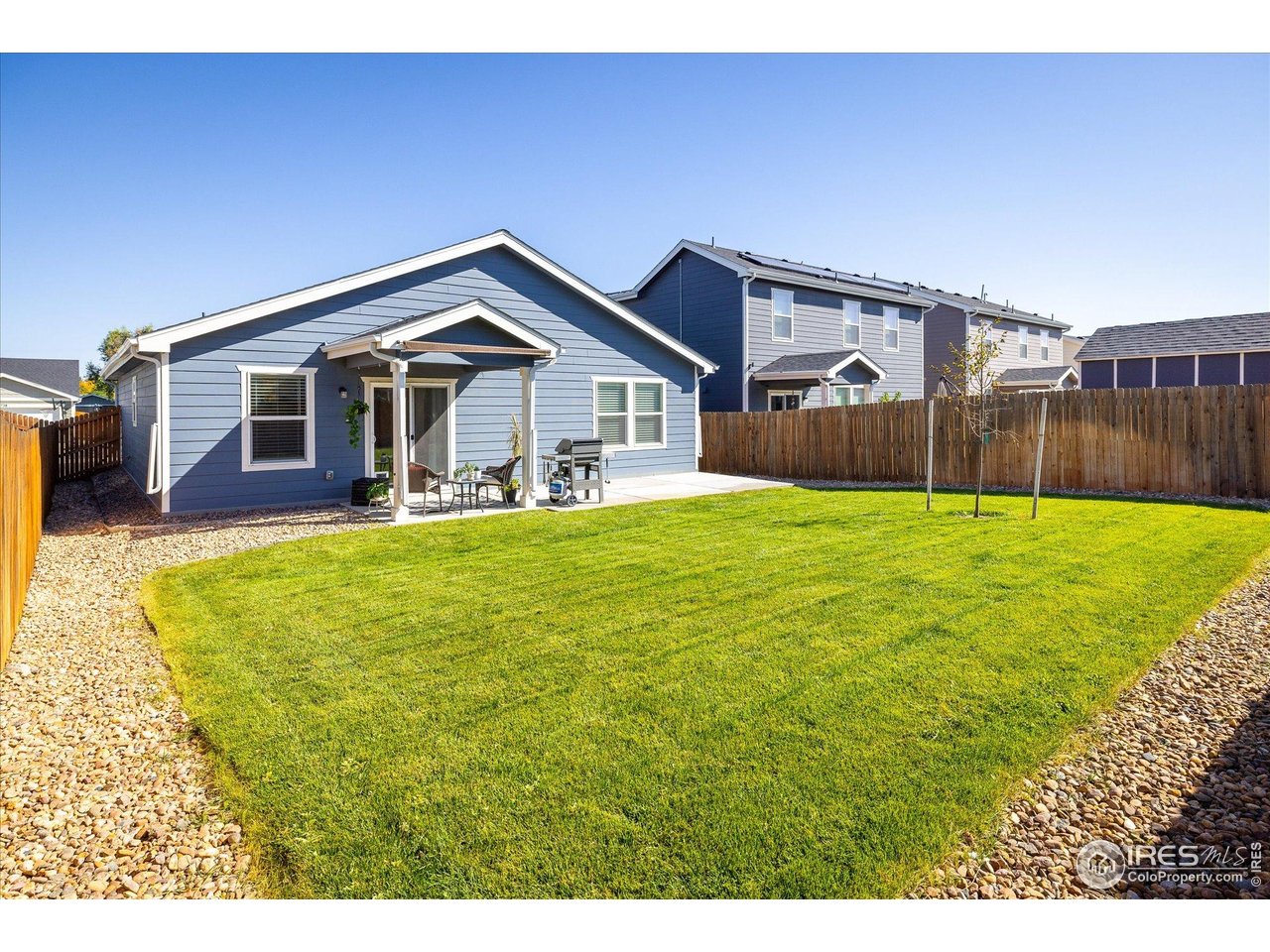 735 South Hoover Avenue Fort Lupton, CO 80621 - Photo 21 of 21 a view of a house with a big yard and potted plants