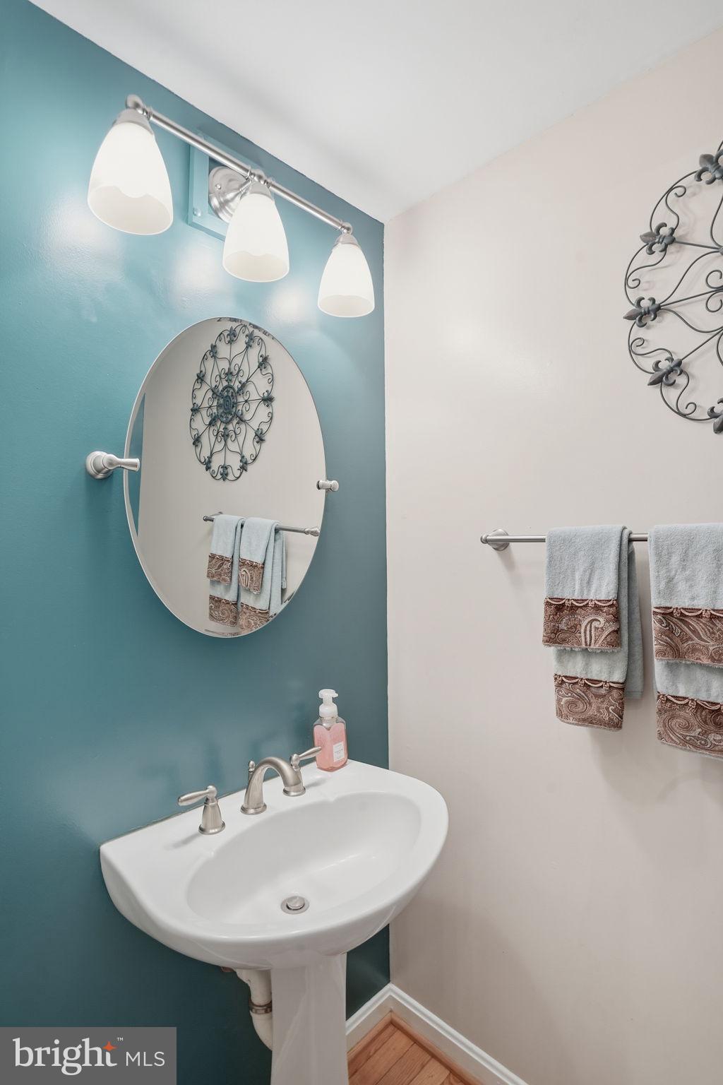 1311 Treasure Drive Odenton, MD 21113 - Photo 12 of 35 a bathroom with a sink and a mirror