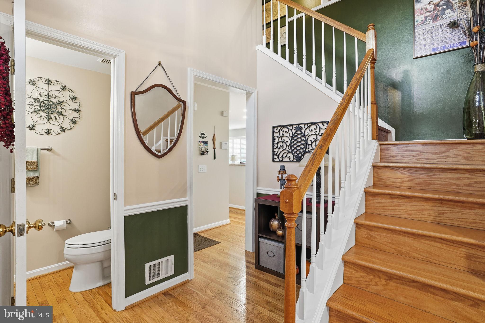 1311 Treasure Drive Odenton, MD 21113 - Photo 13 of 35 a view of entryway and hall with wooden floor