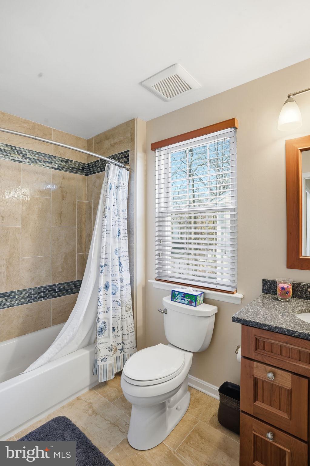 1311 Treasure Drive Odenton, MD 21113 - Photo 18 of 35 a bathroom with a granite countertop bathtub sink vanity mirror and toilet