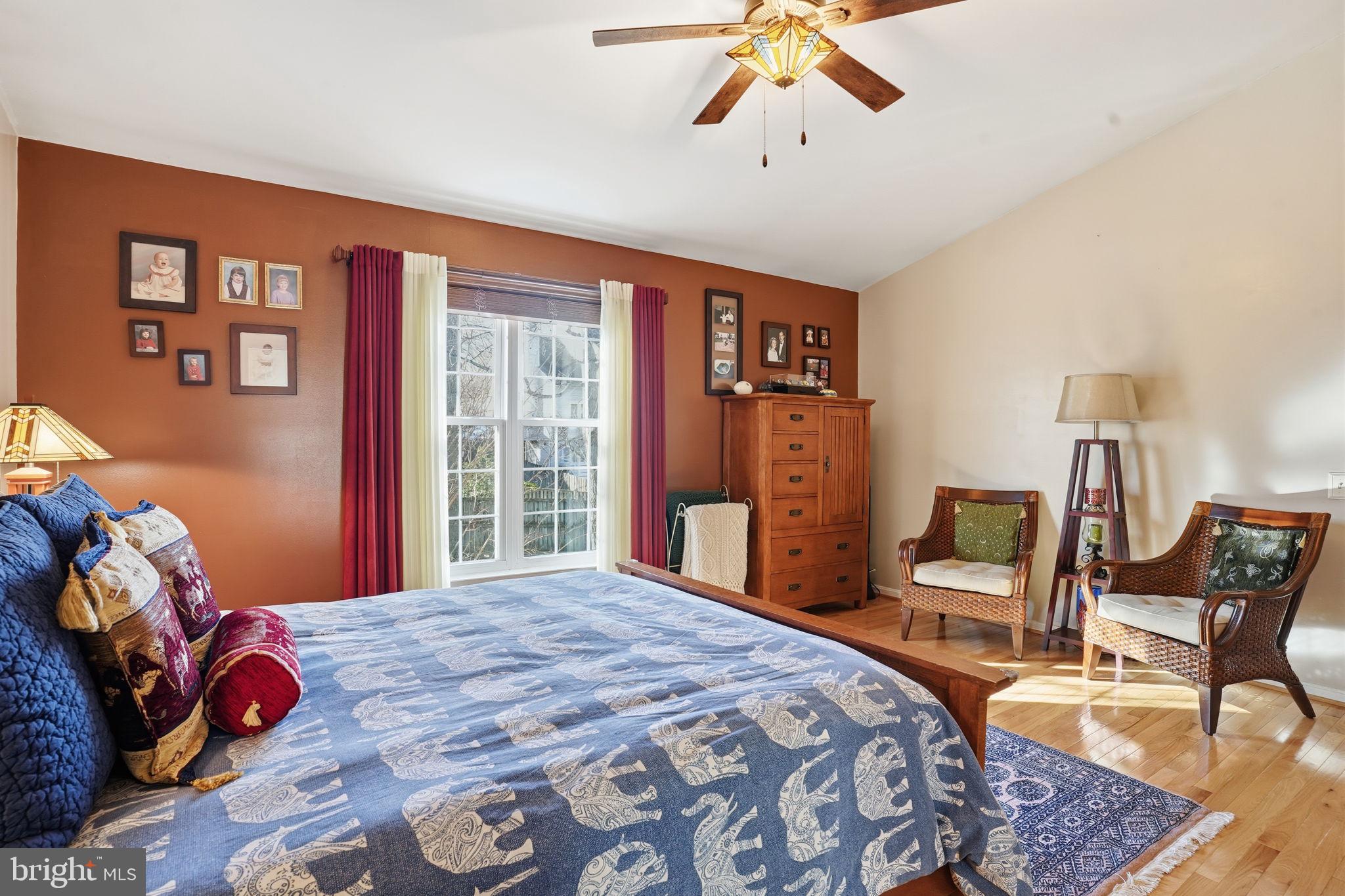 1311 Treasure Drive Odenton, MD 21113 - Photo 19 of 35 a bedroom with a bed and wooden floor