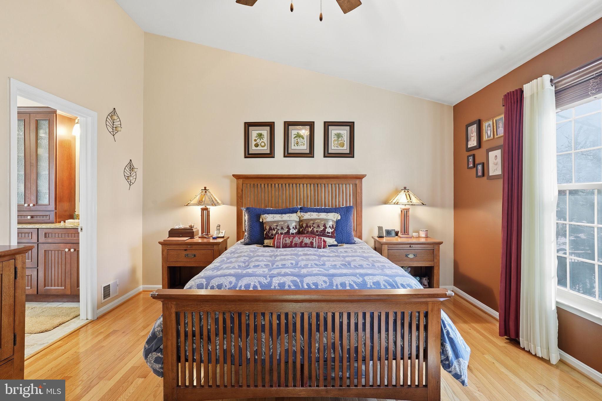 1311 Treasure Drive Odenton, MD 21113 - Photo 21 of 35 a bedroom with a bed and a window with wooden floor