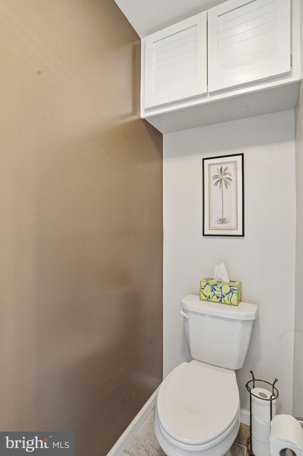 1311 Treasure Drive Odenton, MD 21113 - Photo 23 of 35 a white toilet sitting next to a bathroom sink