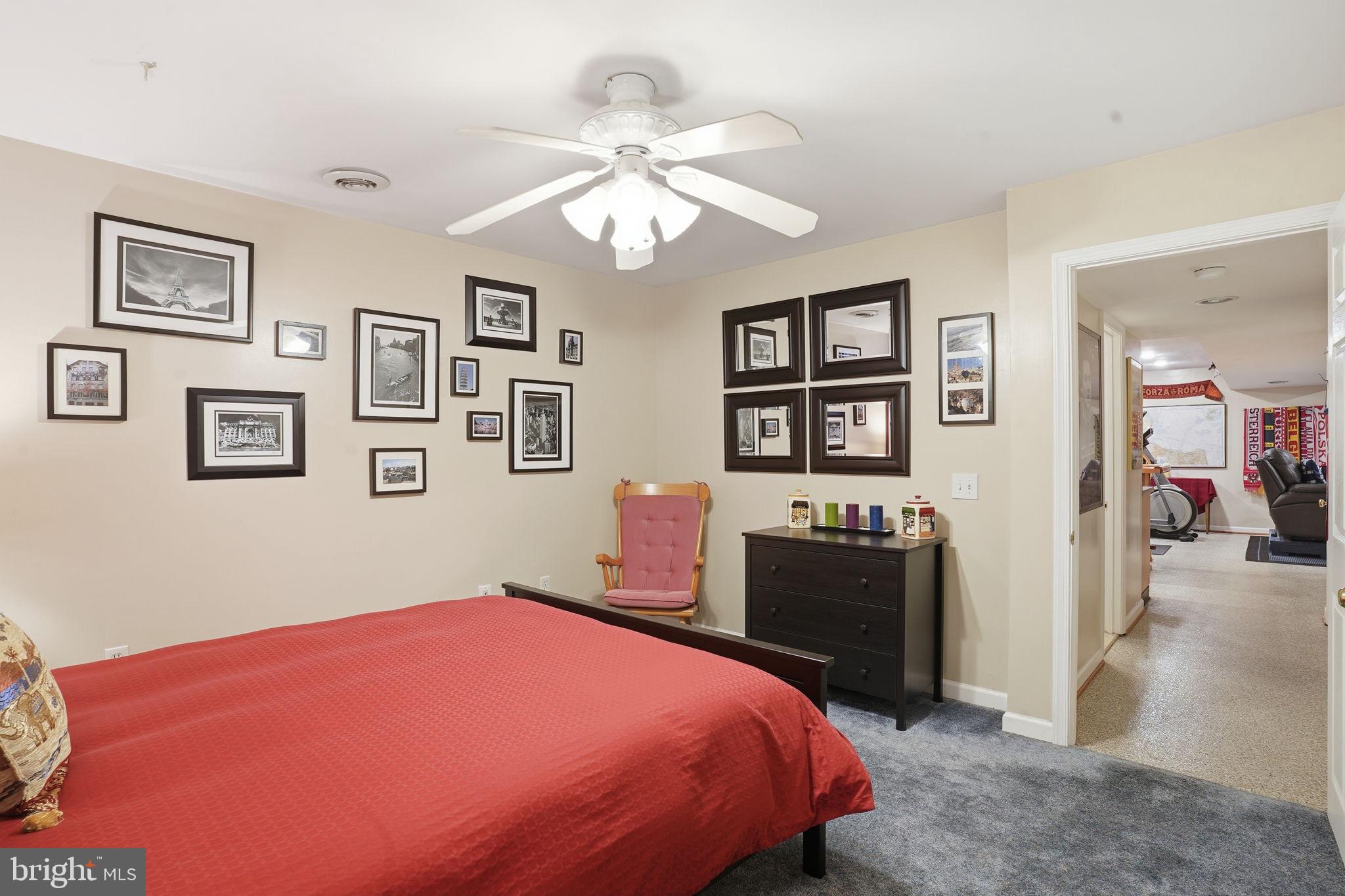 1311 Treasure Drive Odenton, MD 21113 - Photo 32 of 35 a bedroom with a bed and wooden floor