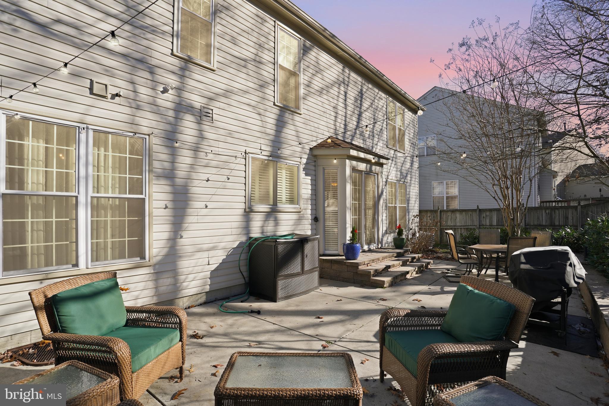 1311 Treasure Drive Odenton, MD 21113 - Photo 33 of 35 a view of a patio with couches table and chairs and potted plants