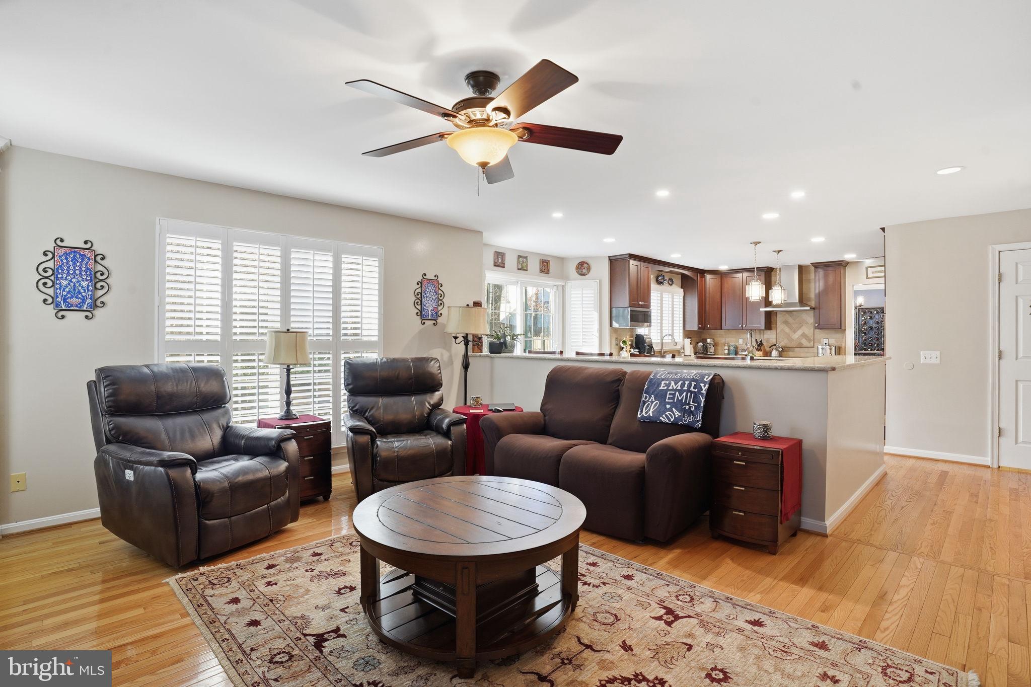 1311 Treasure Drive Odenton, MD 21113 - Photo 4 of 35 a living room with furniture a rug and a chandelier