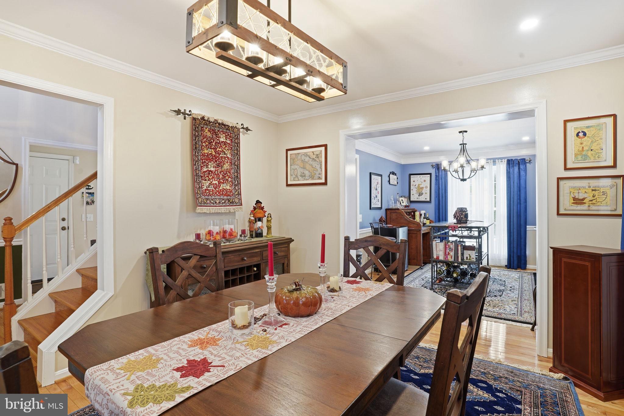 1311 Treasure Drive Odenton, MD 21113 - Photo 9 of 35 a view of a dining room with furniture and wooden floor