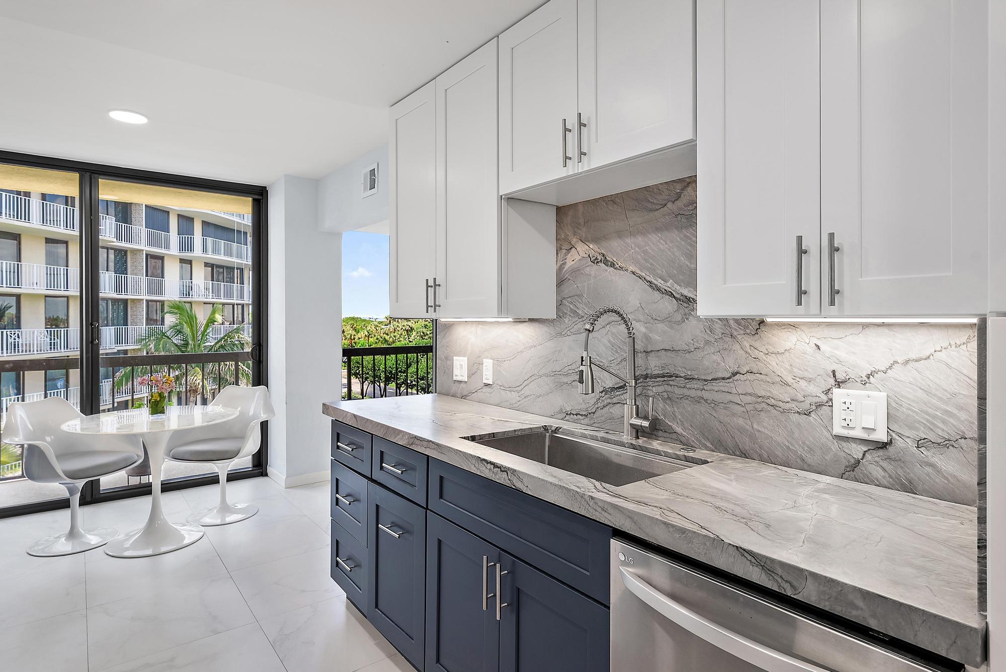 3390 South Ocean Boulevard, Unit 301 Palm Beach, FL 33480 - Photo 15 of 46 a kitchen with a sink and cabinets