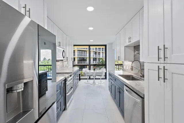 a kitchen with counter top space and stainless steel appliances