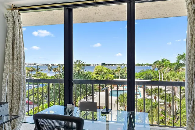 a view of a room with balcony and furniture