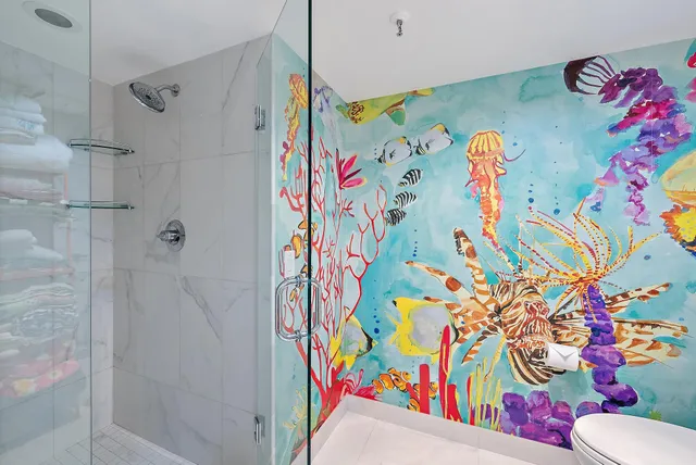 a bathroom with a bathtub and a shower curtain