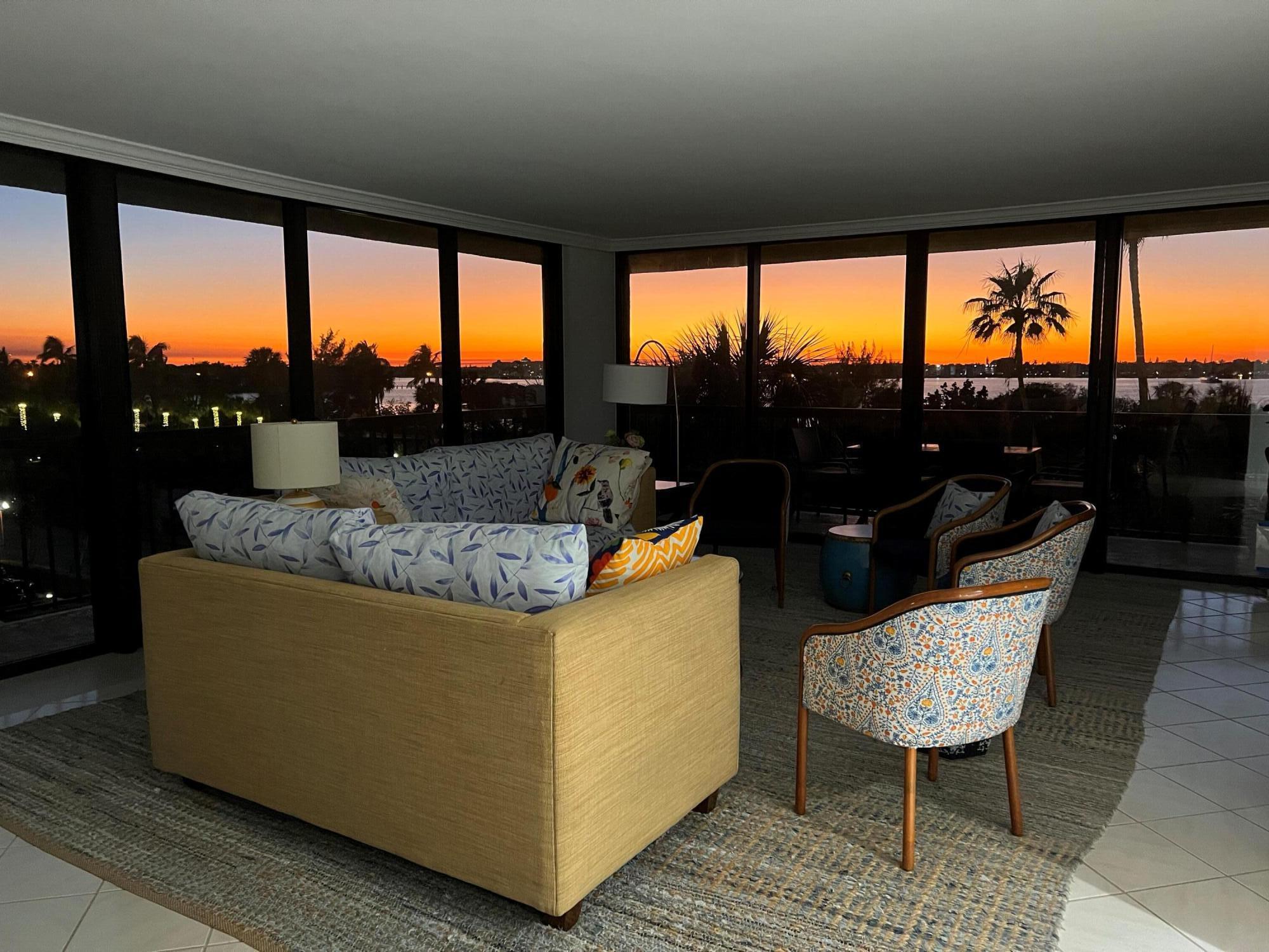 3390 South Ocean Boulevard, Unit 301 Palm Beach, FL 33480 - Photo 32 of 46 a living room with large window and a table