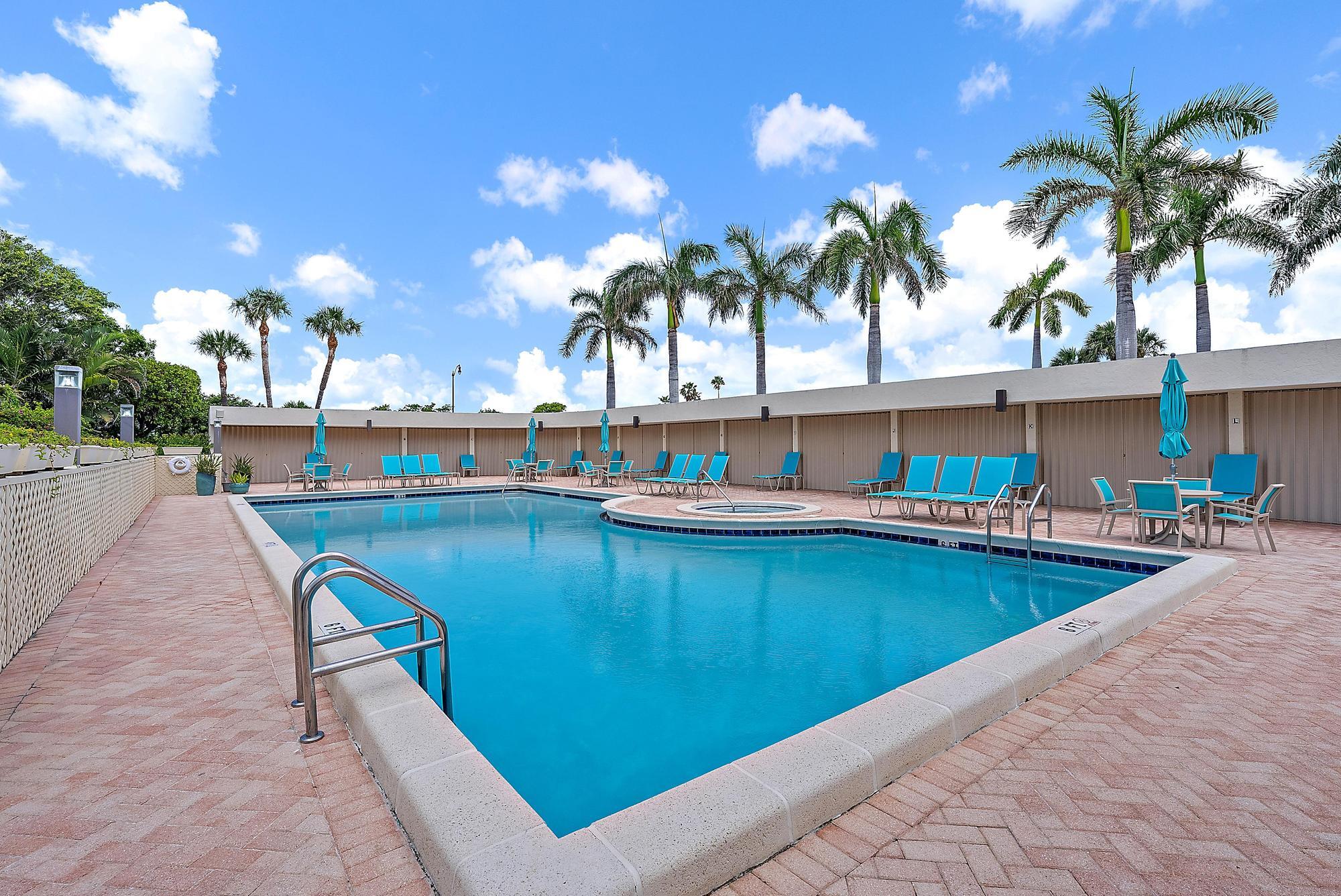 3390 South Ocean Boulevard, Unit 301 Palm Beach, FL 33480 - Photo 38 of 46 a view of swimming pool with outdoor seating and a potted plants