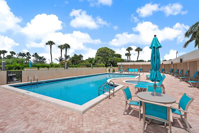 a view of a swimming pool with a lounge chair