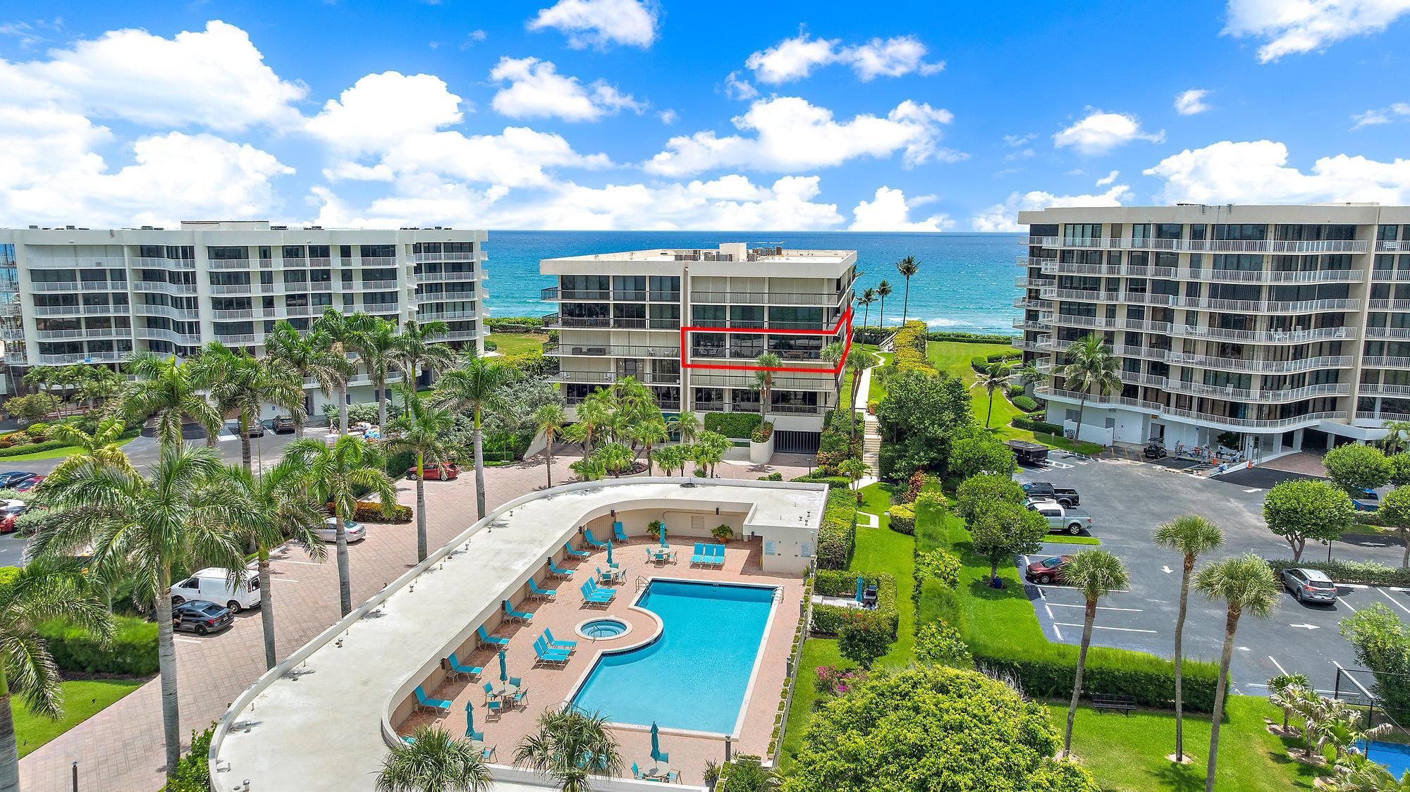3390 South Ocean Boulevard, Unit 301 Palm Beach, FL 33480 - Photo 42 of 46 a view of a multi story building with yard and seating area