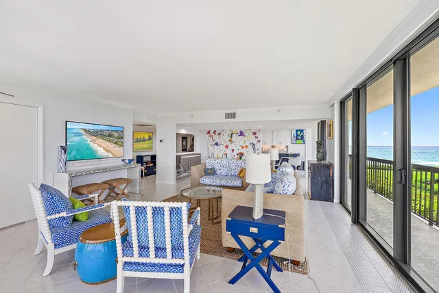 a very nice looking room with many windows and furniture