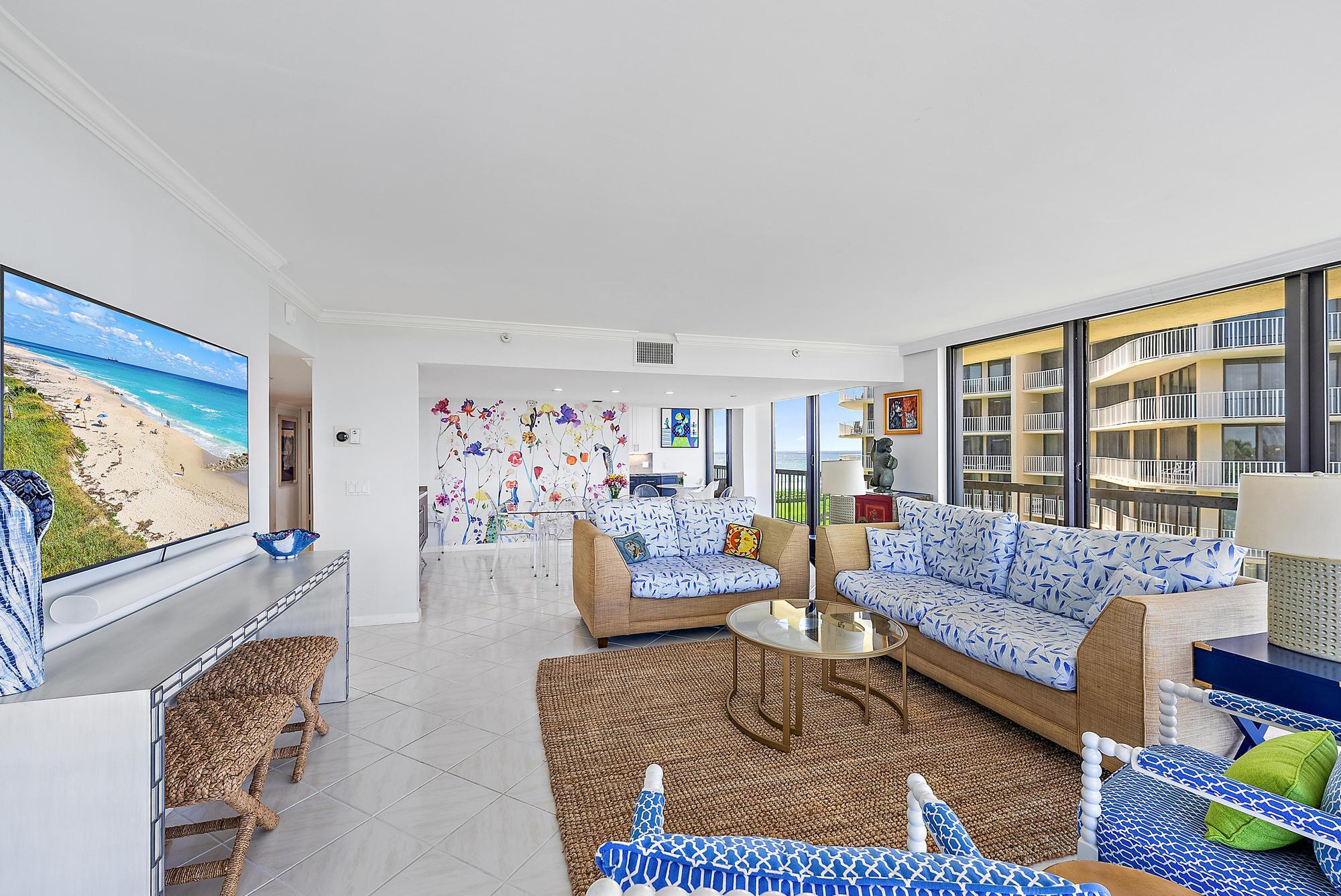 3390 South Ocean Boulevard, Unit 301 Palm Beach, FL 33480 - Photo 8 of 46 a living room with furniture and a flat screen tv