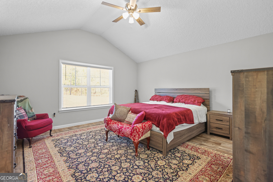 192 Hummingbird Lane Jesup, GA 31545 - Photo 13 of 26 a bedroom with a bed and closet