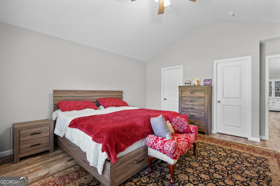 192 Hummingbird Lane Jesup, GA 31545 - Photo 14 of 26 a bedroom with a bed and a dresser