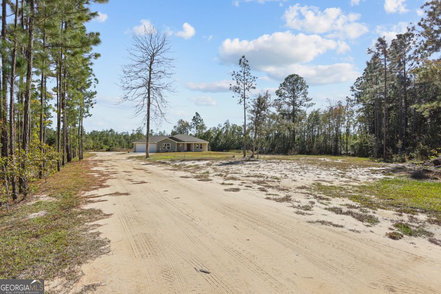 192 Hummingbird Lane Jesup, GA 31545 - Photo 3 of 26 a view of a backyard of a house