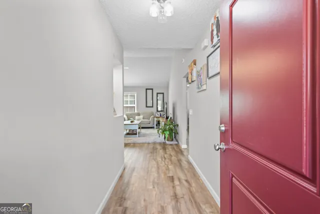 a view of a bedroom with a bed and furniture