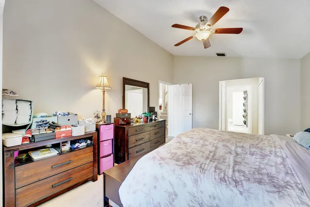 a bed room with a bed and a dresser