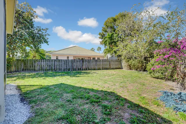 a swimming pool with wooden fence