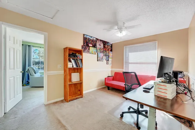 a bedroom with furniture and a window