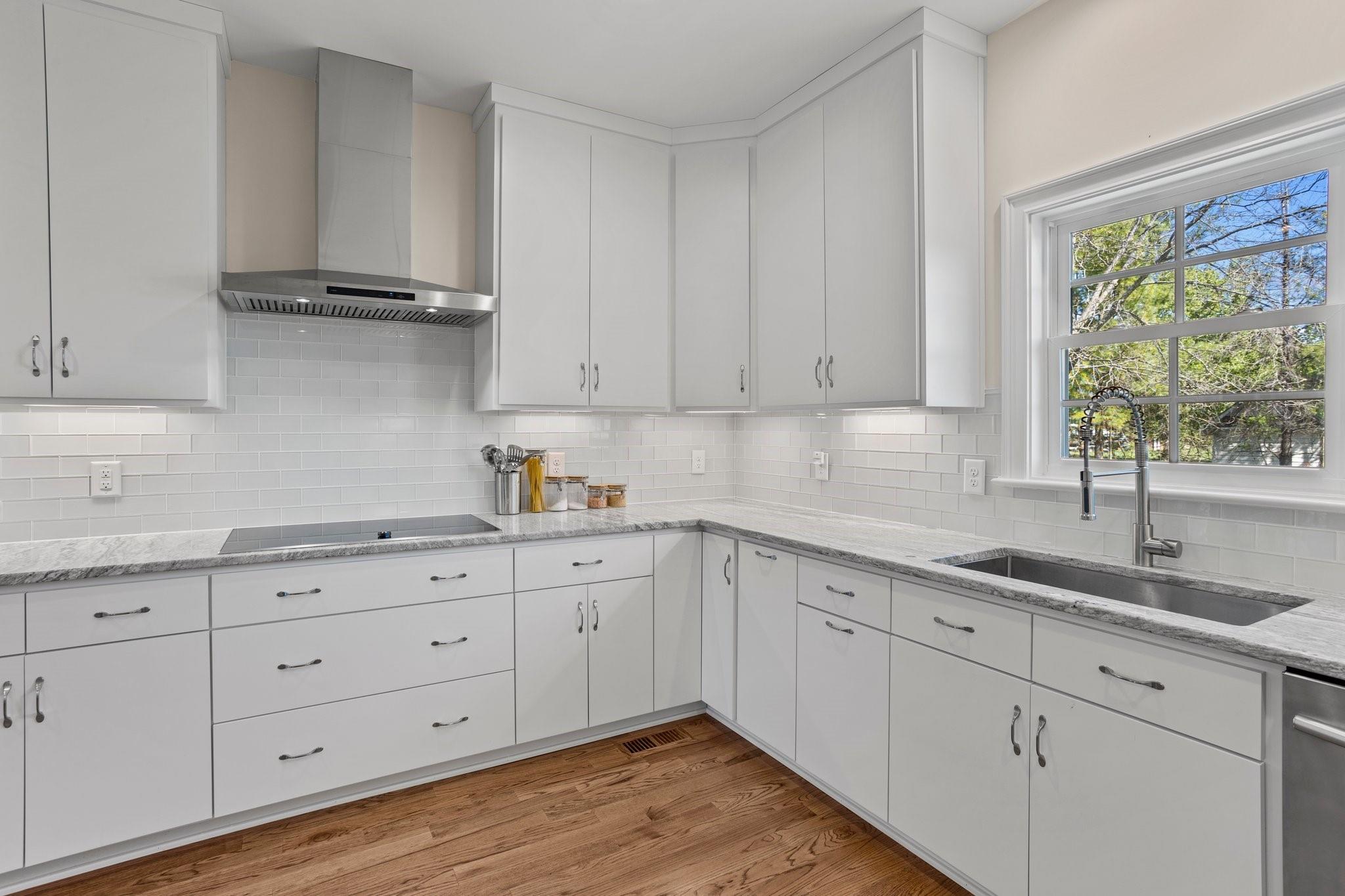 15020 Ranson Road, Unit B Huntersville, NC 28078 - Photo 20 of 40 a kitchen with granite countertop white cabinets and a window