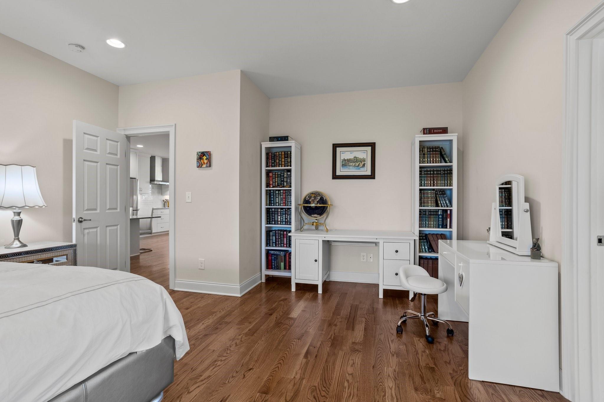 15020 Ranson Road, Unit B Huntersville, NC 28078 - Photo 25 of 40 a bedroom with a bed and a workspace