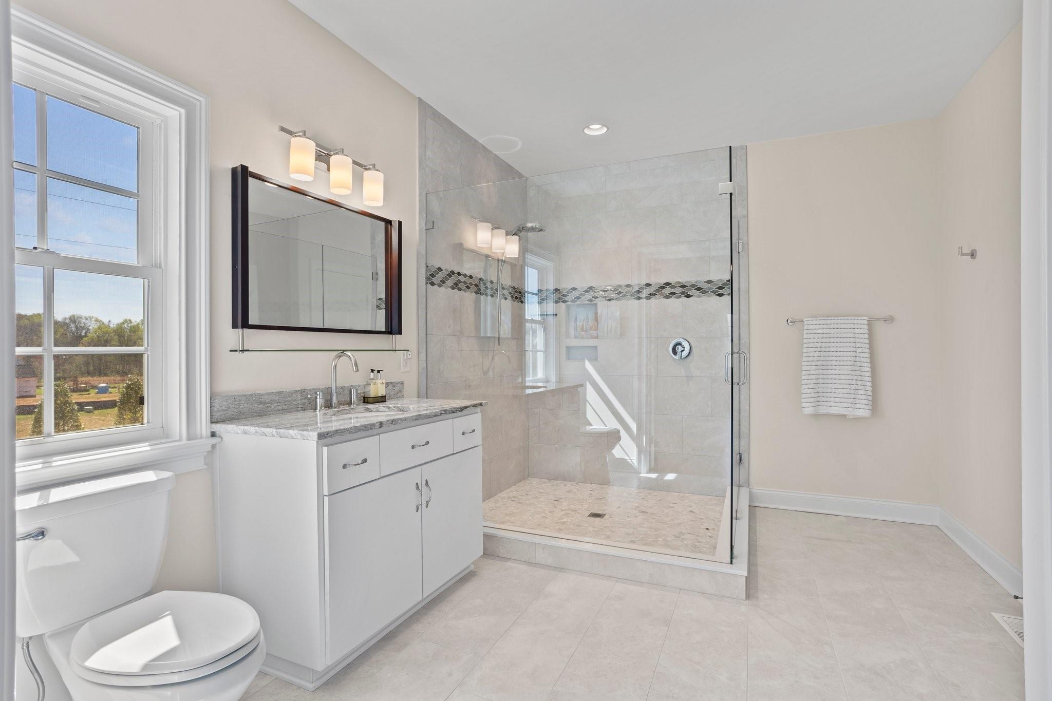 15020 Ranson Road, Unit B Huntersville, NC 28078 - Photo 27 of 40 a bathroom with a granite countertop sink toilet and shower