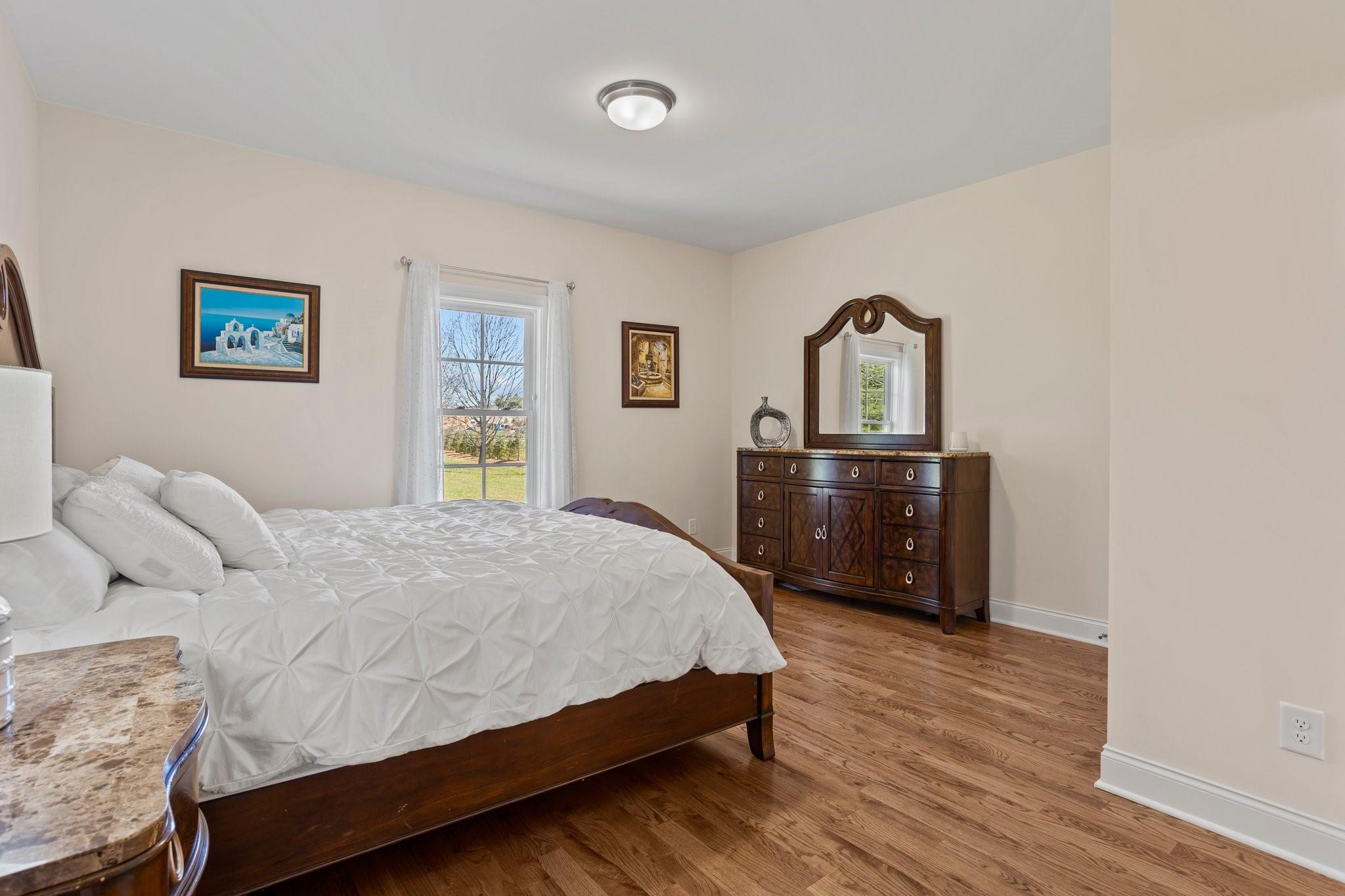 15020 Ranson Road, Unit B Huntersville, NC 28078 - Photo 30 of 40 a bedroom with a bed and a dresser