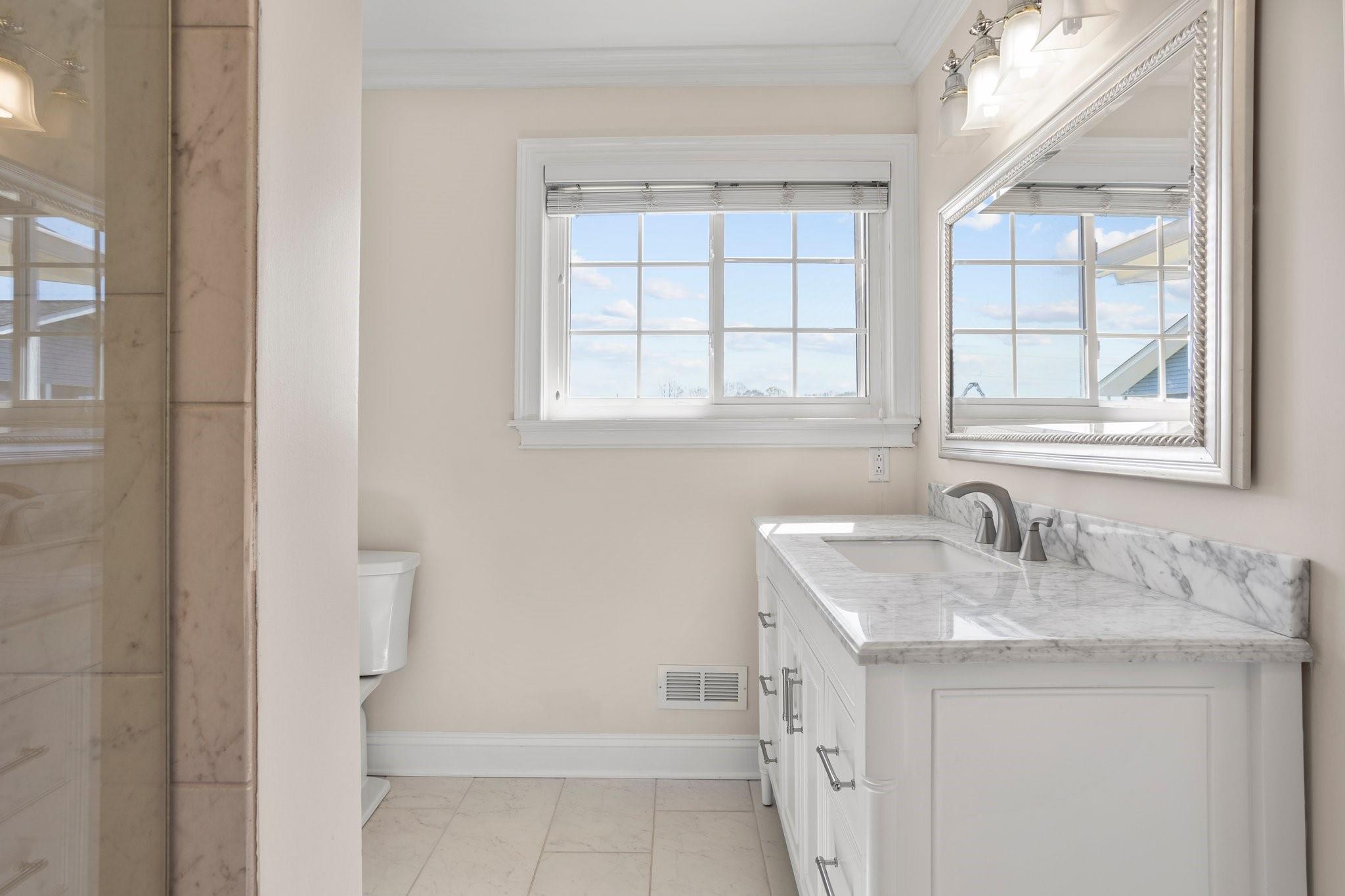 15020 Ranson Road, Unit B Huntersville, NC 28078 - Photo 5 of 40 a bathroom with a sink and a vanity