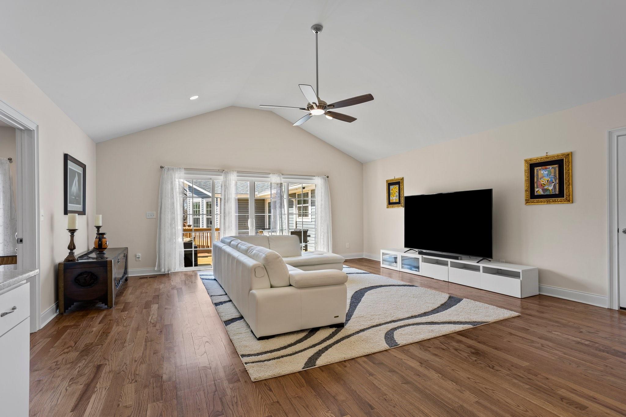 15020 Ranson Road, Unit B Huntersville, NC 28078 - Photo 8 of 40 a living room with furniture flat screen tv and wooden floor