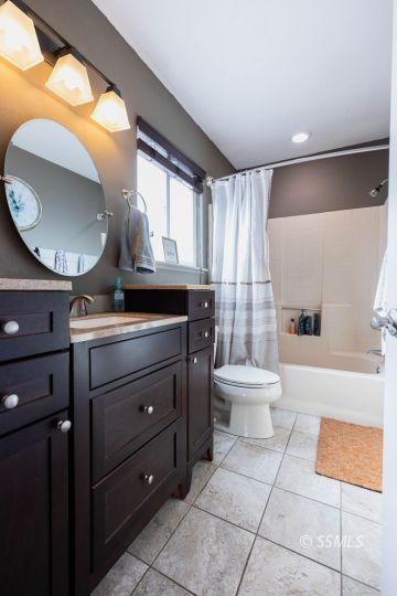 632 South Gordon Street Ridgecrest, CA 93555 - Photo 19 of 30 a bathroom with a toilet a sink and a mirror