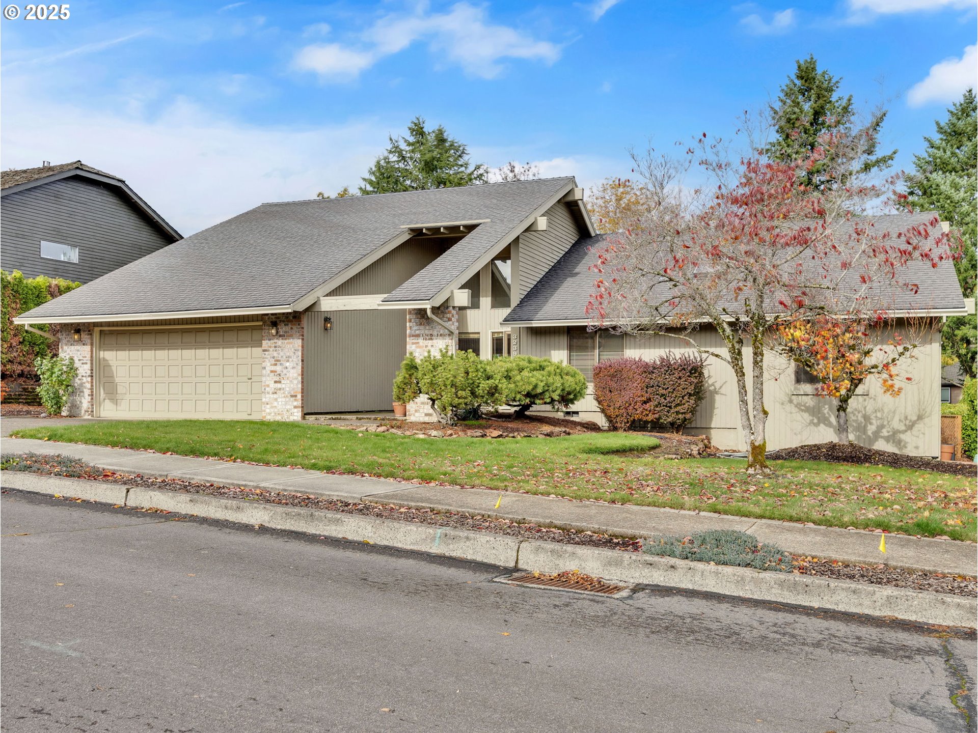 3239 Southwest 26th Street Gresham, OR 97080 - Photo 1 of 47 a front view of a house with a garden and plants