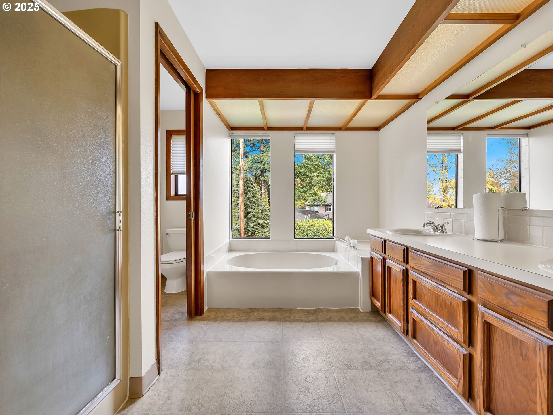 3239 Southwest 26th Street Gresham, OR 97080 - Photo 19 of 47 a bathroom with a tub sink and window