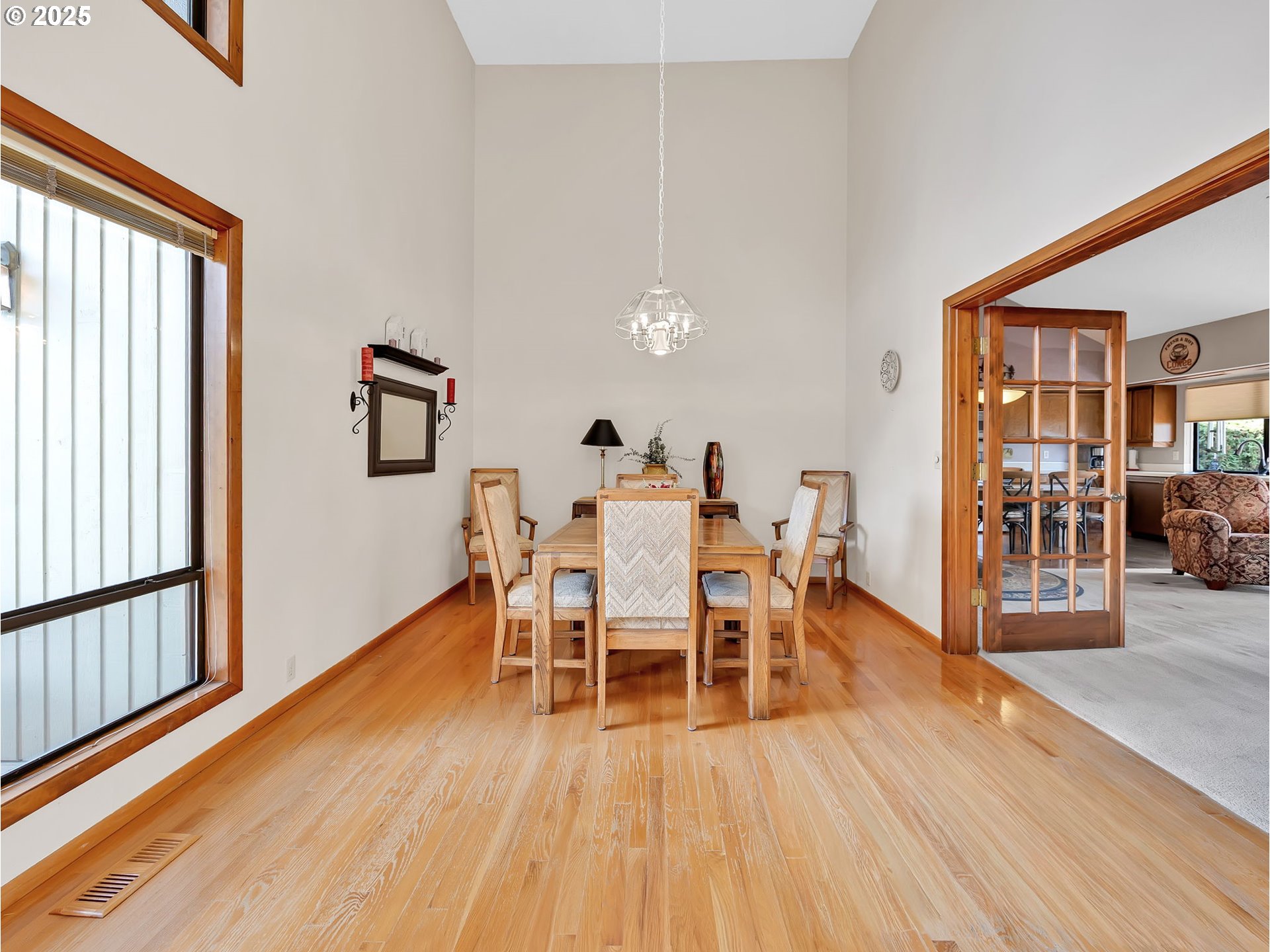 3239 Southwest 26th Street Gresham, OR 97080 - Photo 3 of 47 a dining room with furniture wooden floor and a rug