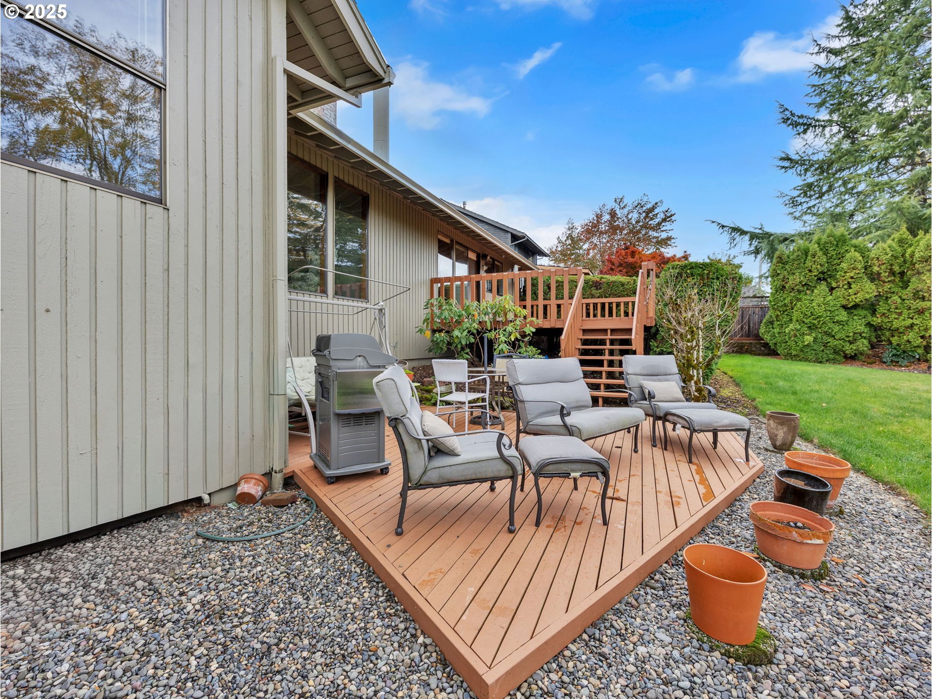 3239 Southwest 26th Street Gresham, OR 97080 - Photo 34 of 47 a view of a patio with couches table and chairs and potted plants