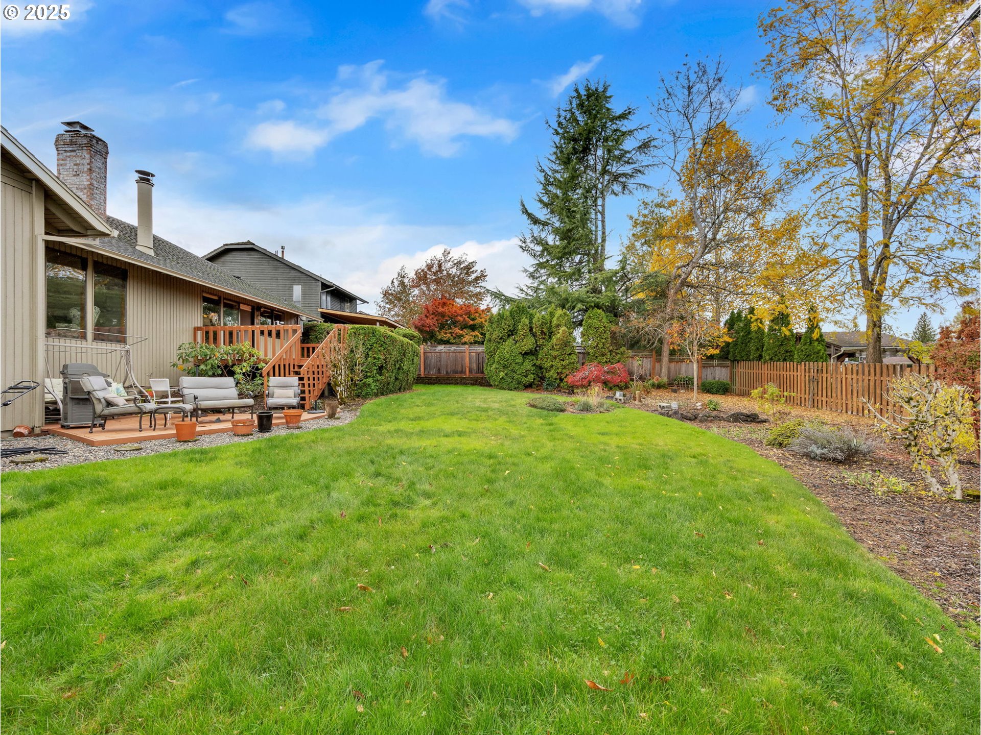 3239 Southwest 26th Street Gresham, OR 97080 - Photo 37 of 47 a backyard of a house with table and chairs