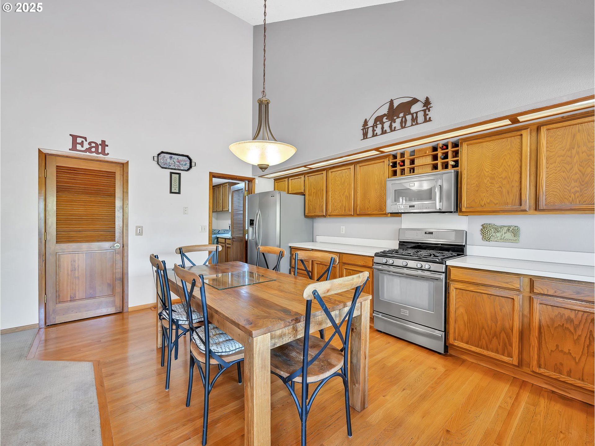3239 Southwest 26th Street Gresham, OR 97080 - Photo 8 of 47 a view of a dining room with furniture and wooden floor