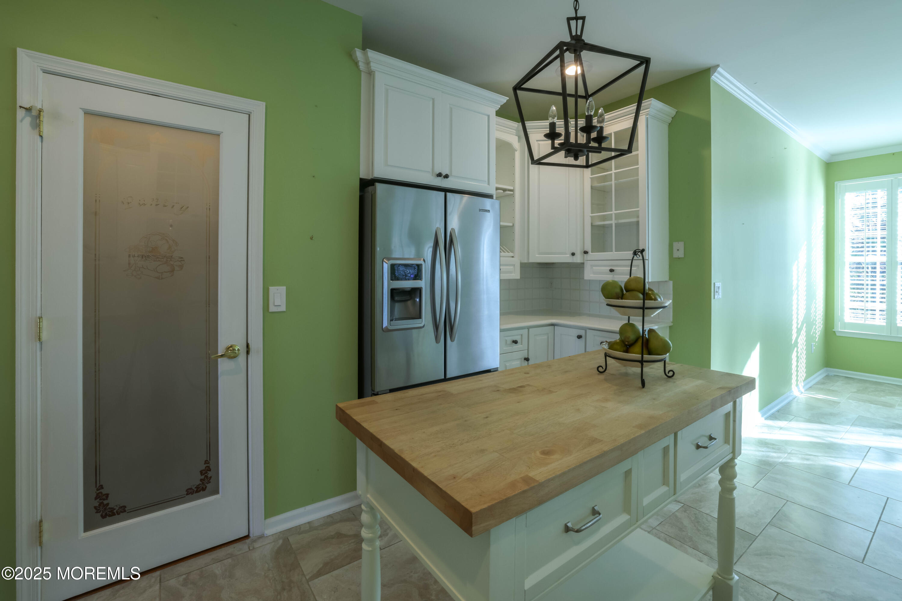 44 Portland Street Barnegat, NJ 08005 - Photo 13 of 47 a kitchen with a table and refrigerator