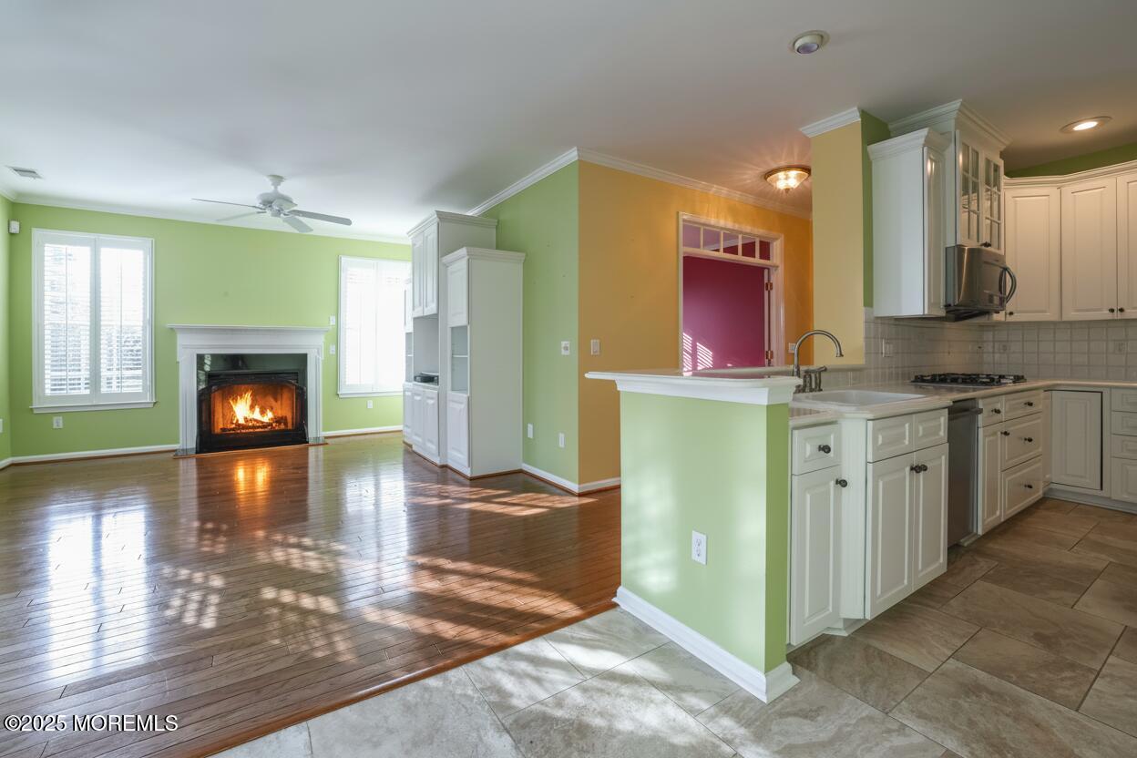 44 Portland Street Barnegat, NJ 08005 - Photo 20 of 47 a kitchen with stainless steel appliances granite countertop a refrigerator a stove and a wooden floors