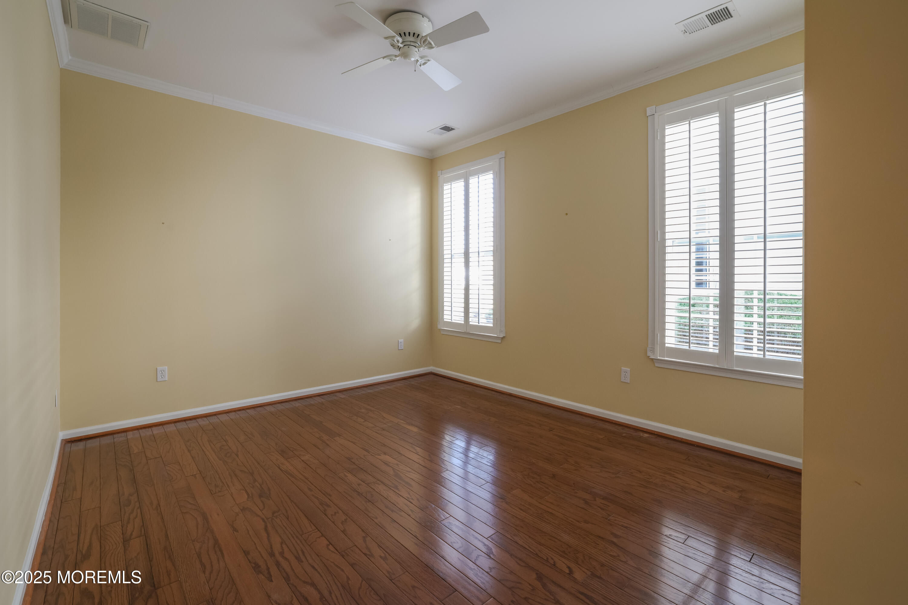 44 Portland Street Barnegat, NJ 08005 - Photo 26 of 47 a view of an empty room with wooden floor and a window