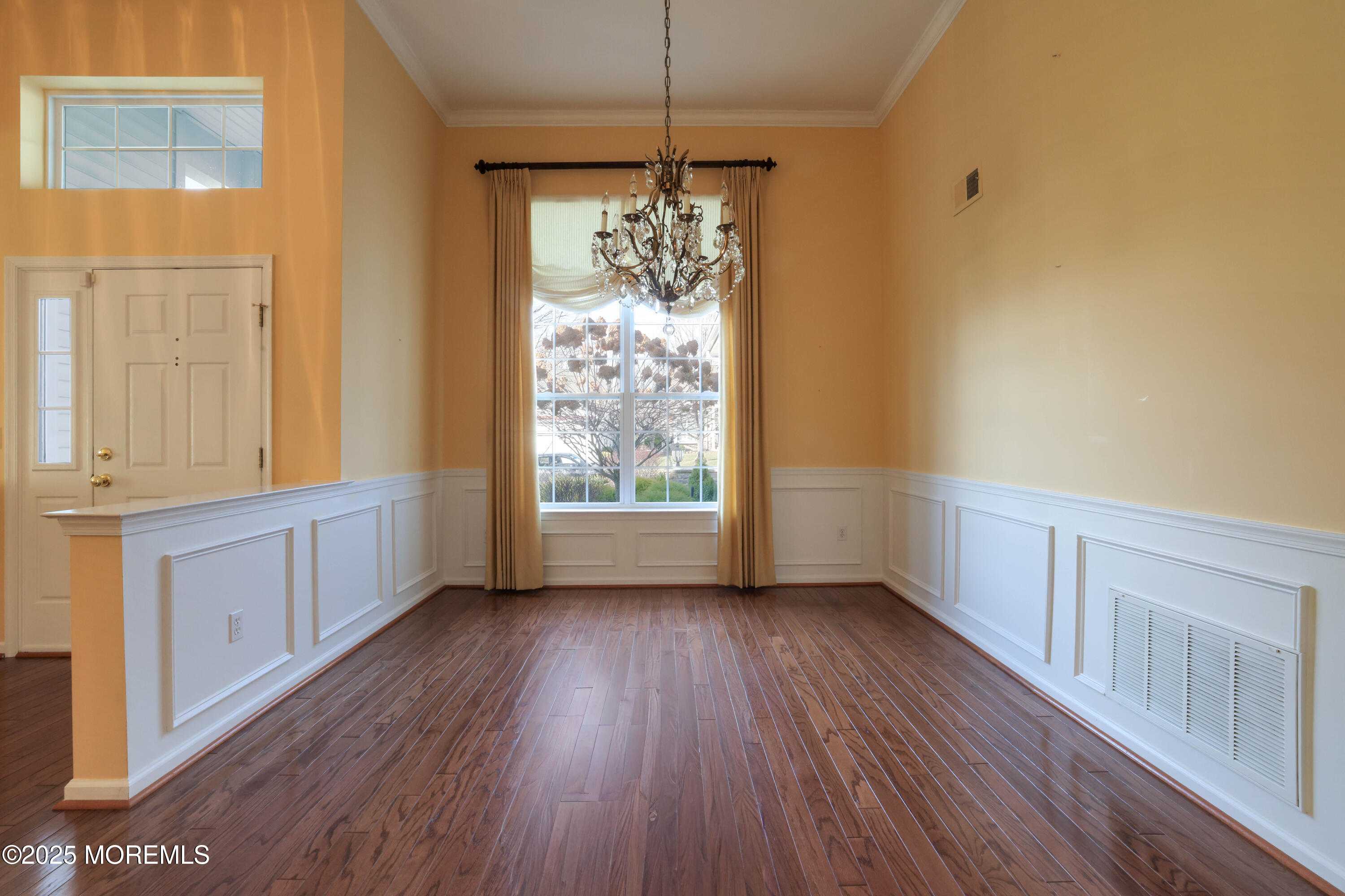 44 Portland Street Barnegat, NJ 08005 - Photo 5 of 47 a view of an empty room with a window and wooden floor