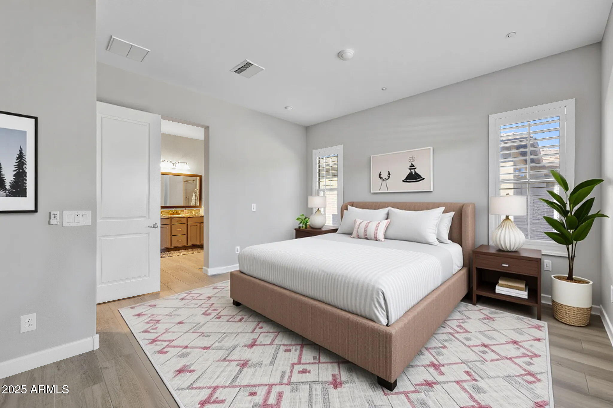 13189 West Caleb Road Peoria, AZ 85383 - Photo 30 of 70 a spacious bedroom with a large bed and a rug